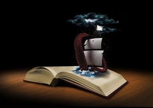 Un libro abierto en el que hay un mar dibujado. Sobre el mar navega un barco de vela que es atacado por un tentáculo gigante.